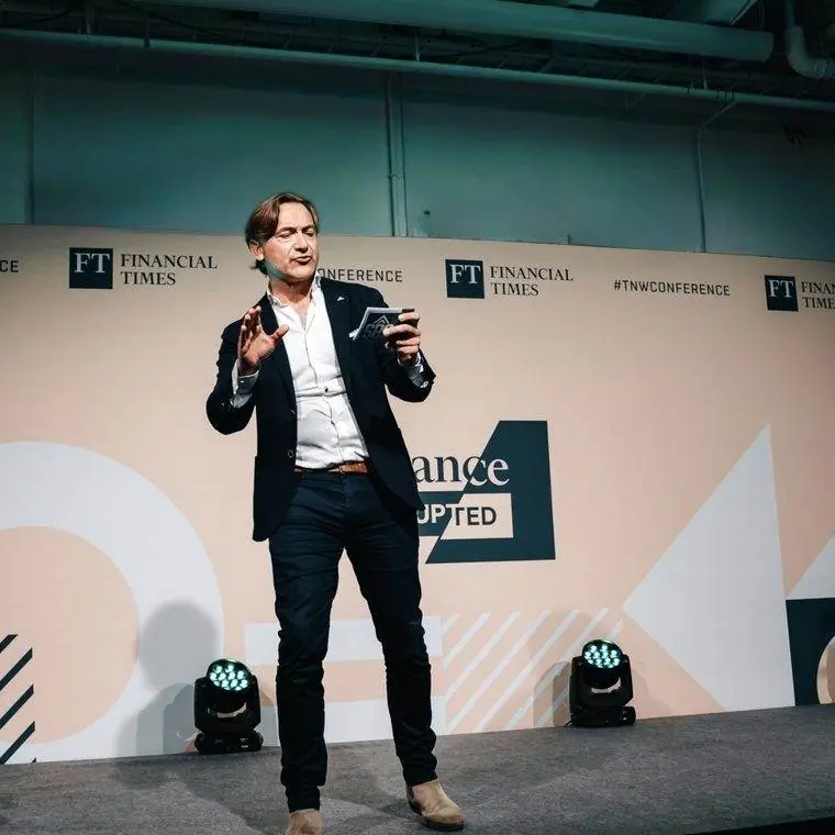 Willem Knaap speaking on stage at the FT TNW Conference